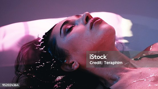 istock Young woman floating in Spa bath or swimming pool, she is very relaxed. Welness concept 952024364