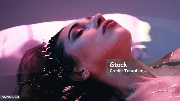 Young Woman Floating In Spa Bath Or Swimming Pool She Is Very Relaxed Welness Concept Stock Photo - Download Image Now