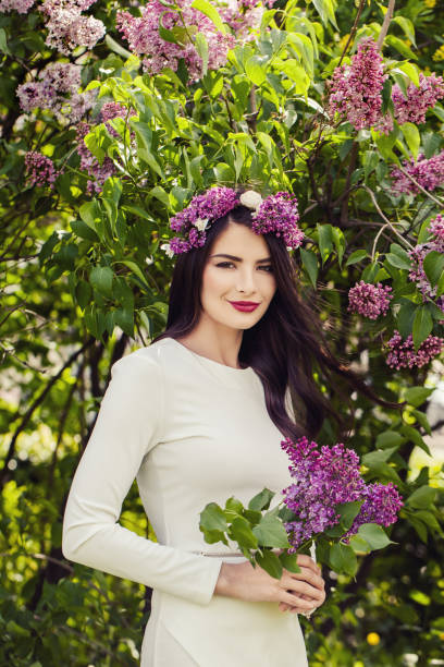 istock Attractive Brunette Woman Outdoors on Floral Spring Background 952028168