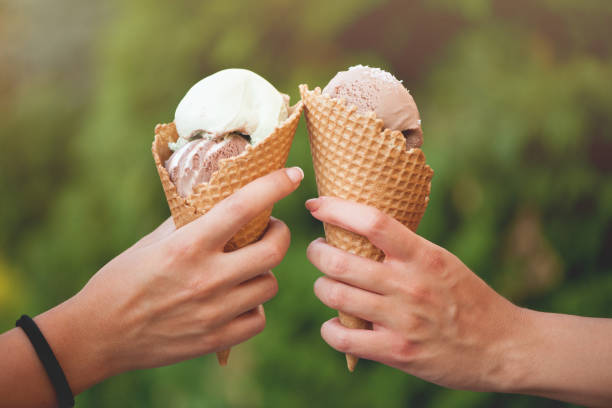 ice-cream ice cream in hands.Close up cone shape photos stock pictures, royalty-free photos & images