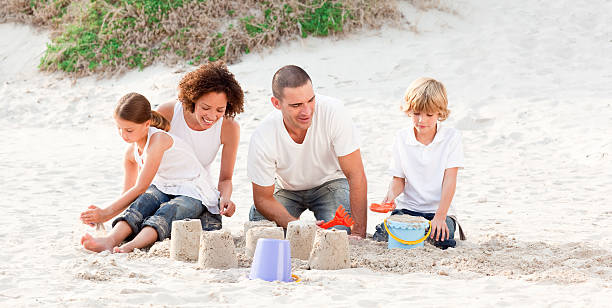 istock Family playing with the sand 95202946
