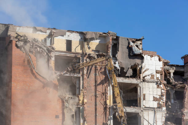 istock Heavy equipment being used to tear tearing down building construction 952031982