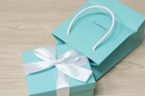 Hong Kong 26 January 2018 Signature Tiffany Co Blue Box Brand Package Of  Luxury Jewelry Brand Tiffany And Co On A Wood Texture Background Hong Kong  26 January 2018 Stock Photo - Download Image Now - iStock