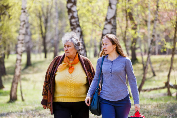 istock Elderly couple and young caregiver 952034650