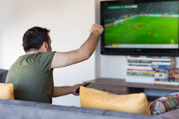 istock Man Watching Football Match 952035584