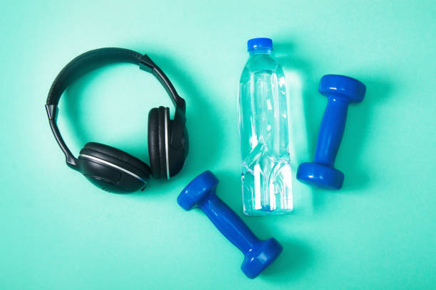 istock Sport flat lay composition with dumbbells and headphones 952036888