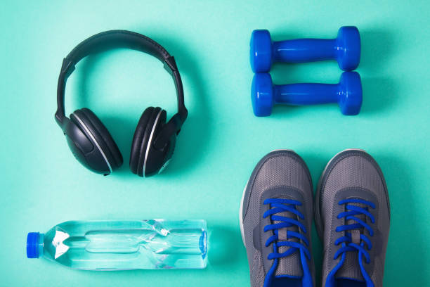 istock Sport flat lay composition with dumbbells and headphones 952036894