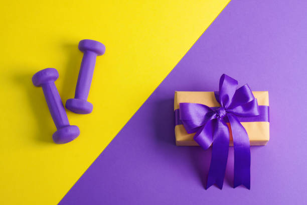 istock Sport flat lay composition with dumbbells and gift box 952036906