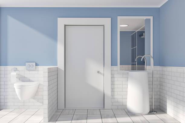 istock Blue and brick wall bathroom, round sink, toilet 952037778