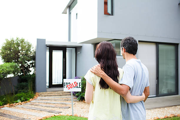 istock Newlyweds with their new house 95203846