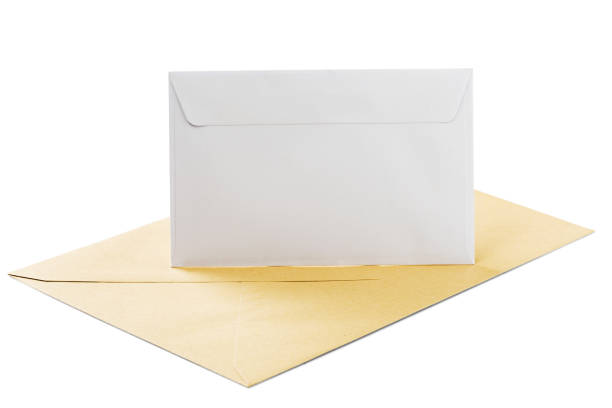 istock Two envelopes in white and kraft paper on isolated white background with shadows 952039514