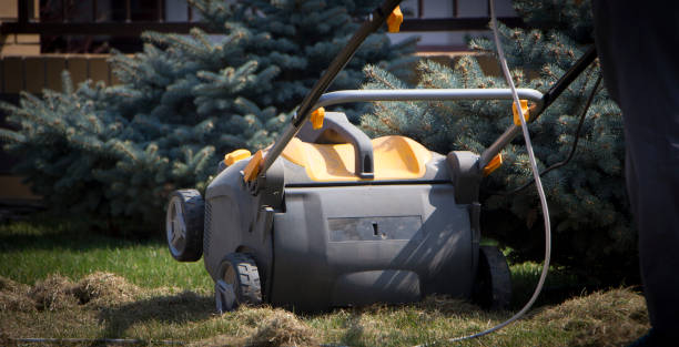 istock Gardener Operating Soil Aeration Machine on Grass Lawn 952040054