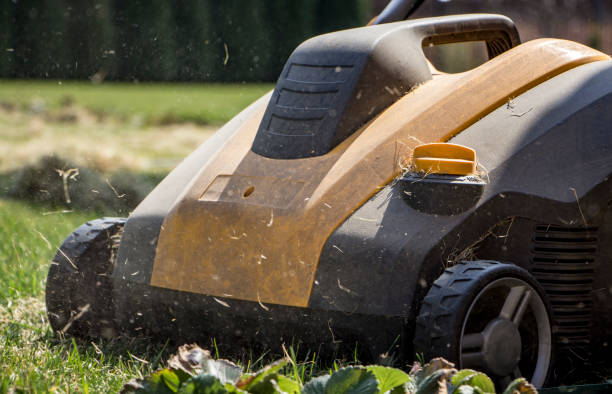 istock Gardener Operating Soil Aeration Machine on Grass Lawn 952040568