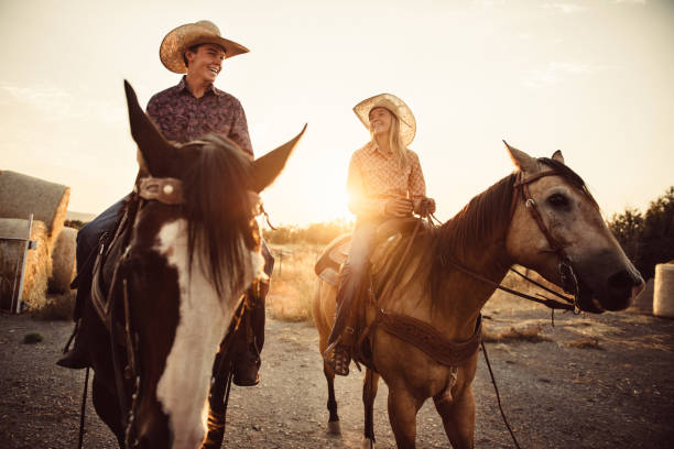 istock Brother and Sister Horseback Riding Together 952044422