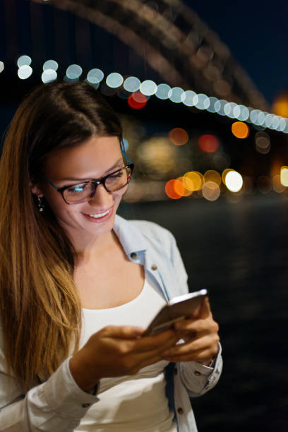 istock Girl smiling and texting 952046846