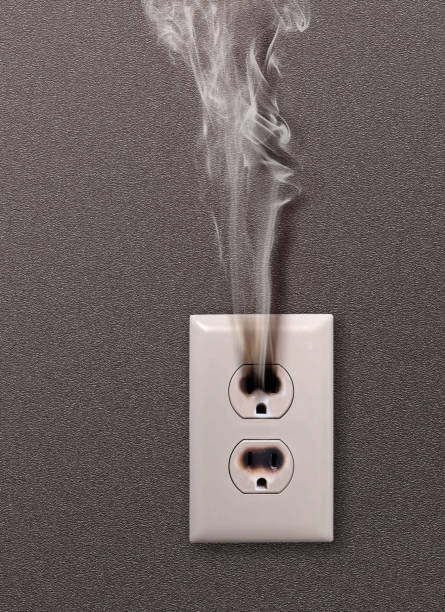 dangerous electrical outlet stock photo