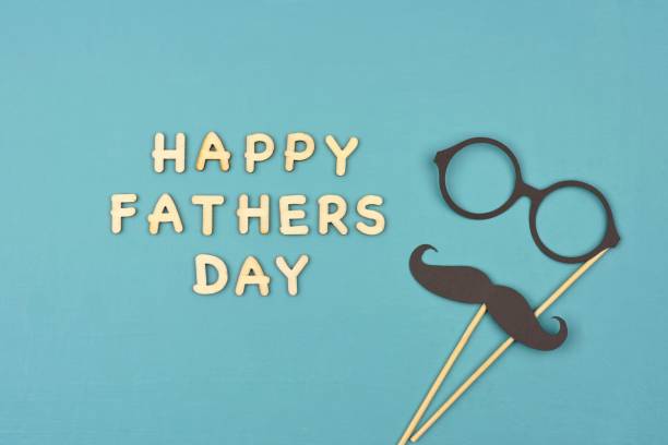 istock Happy Fathers Day with mustache and glasses over a blue background 952047184
