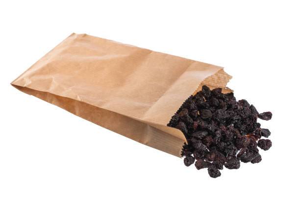 istock Dried black cherries isolated on white background. 952048864