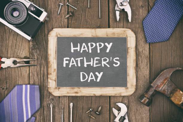 istock Happy Fathers Day chalkboard with frame on rustic wood with vintage styling 952049010