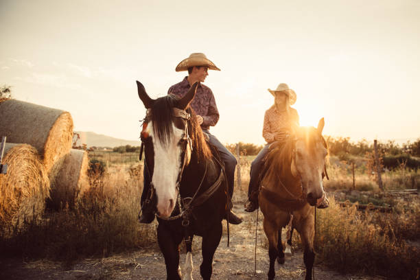 istock Brother and Sister Horseback Riding Together 952050472