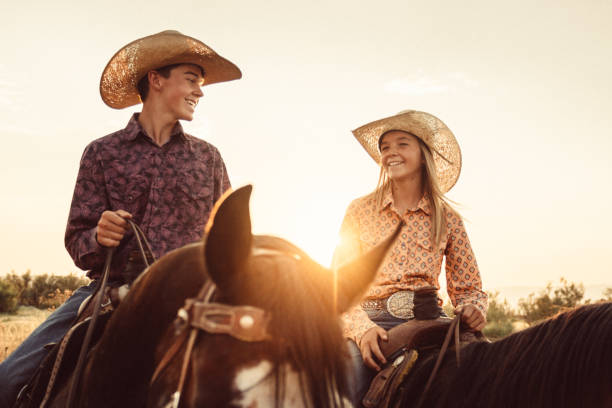 istock Brother and Sister Horseback Riding Together 952053628