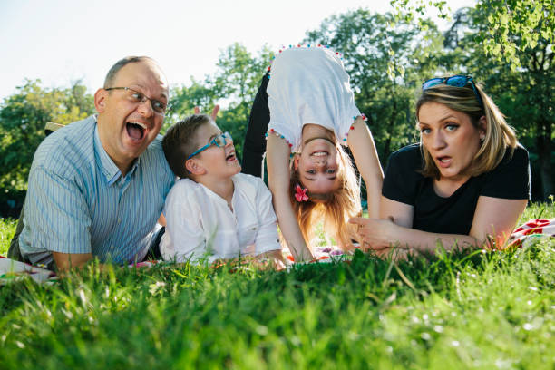 istock Happy family lying on grass 952054286