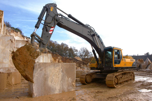 istock Excavator and a truck in Marble Quarry. 952055772