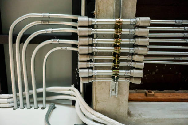 istock Pattern of Electrical conduit forming a pattern of lines on a girder and wall. house and office loft style, 952055818