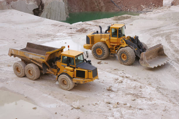 istock Excavator and a truck in Marble Quarry. 952055830