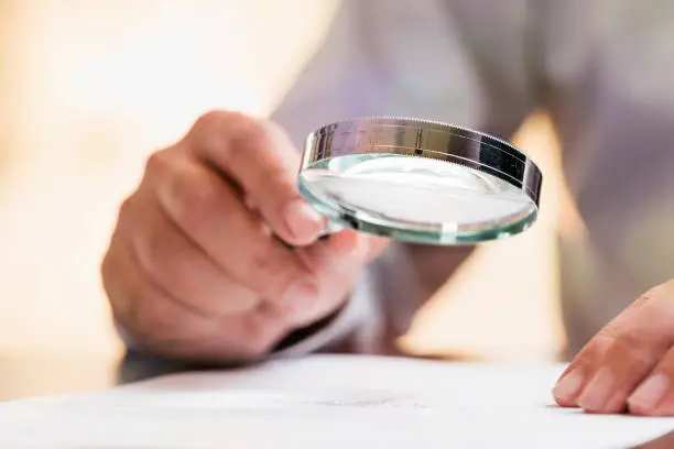 Photo of Businessman Reading Contract Details Before Signing