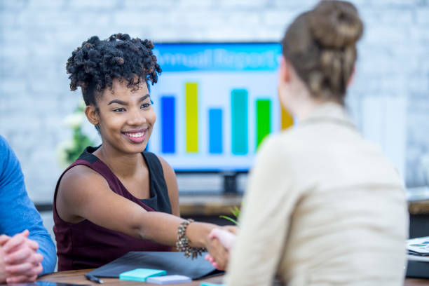 istock Two businesswoman shaking hands 952056380