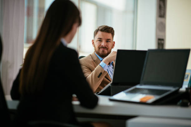 istock Young colleagues sitting together and working in the office 952056428