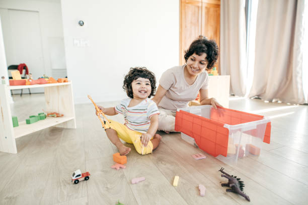 istock Cleaning up with a toddler 952058676