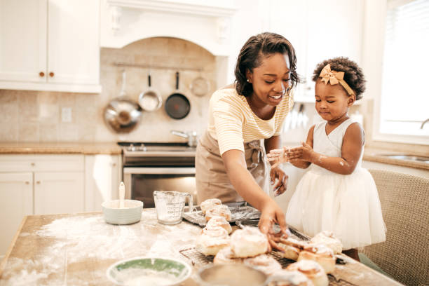 istock Mom and toddler baking together 952058680