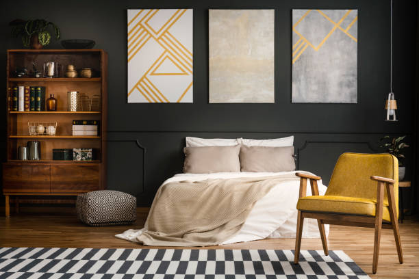 istock Pendant light above yellow armchair 952059222