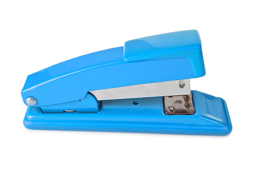 Blue stapler lies isolated on a white background