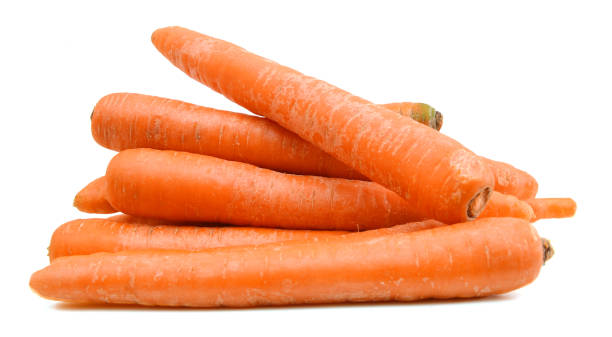 Carrot tubers isolated on white background Carrot tubers isolated on white background pile of carrots stock pictures, royalty-free photos & images