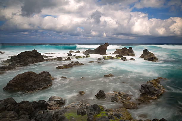 Waves breaking on shore rocks on Maui North Shore stock photo