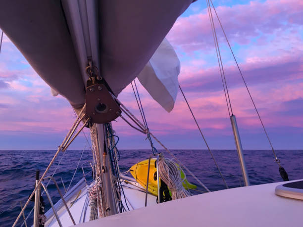 Morning sail at sunrise in the Pacific Ocean stock photo