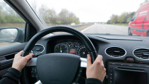 istock Young woman overtaking other car on highway 952060662