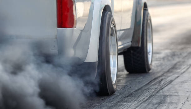 Air pollution from vehicle exhaust pipe on road Air pollution from vehicle exhaust pipe on road smog car stock pictures, royalty-free photos & images