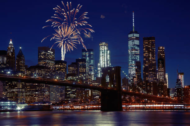 istock Fireworks over New York City skyline and Brooklyn Bridge 952065110