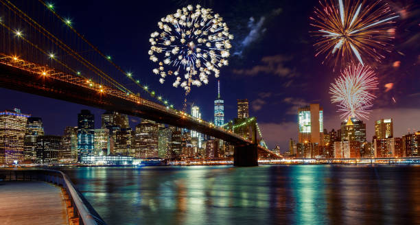 Fireworks over Manhattan, New York City. Fireworks over Manhattan, New York City skyline and Brooklyn Bridge circa 4th century stock pictures, royalty-free photos & images