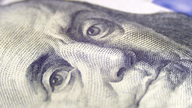 Portrait of President Benjamin Franklin on a Hundred Dollar bill Rotate