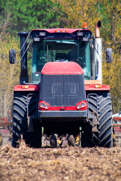 istock Farmer in tractor preparing land with seedbed cultivator 952066076