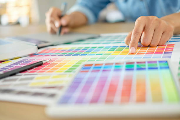 istock Graphic design and color swatches and pens on a desk. Architectural drawing with work tools and accessories. 952068260