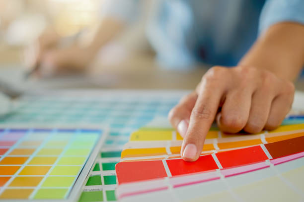 istock Graphic design and color swatches and pens on a desk. Architectural drawing with work tools and accessories. 952068264