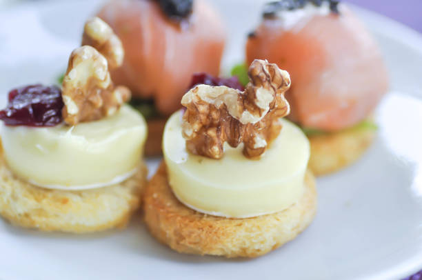 canape or chesse canape with walnut and plum topping