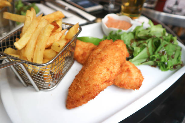 istock fish and chip or fried fish with vegetable and fries 952070386