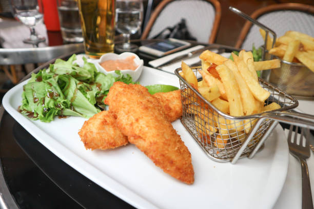 istock fish and chip or fried fish with vegetable and fries 952070414